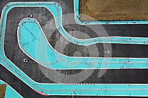 Aerial drone view of carting race track. Karting racetrack view above. Speedway kart field