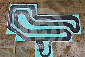 Aerial drone view of carting race track. Karting racetrack view above. Speedway kart field