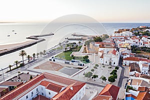 Aerial drone view of central part and marina of Lagos, Algarve, Portugal at morning