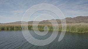 Aerial Drone View of Colorado river close to Parker Dam on a bright sunny day showing Arizona and California