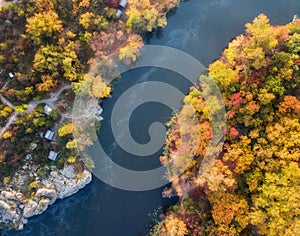 Aerial drone view of colorful forest, blue river and rocks. beautiful autumn landscape