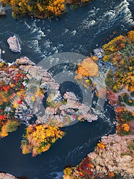 Aerial drone view of colorful forest, blue river and rocks. beautiful autumn landscape