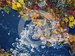Aerial drone view of colorful forest, blue river and rocks. beautiful autumn landscape