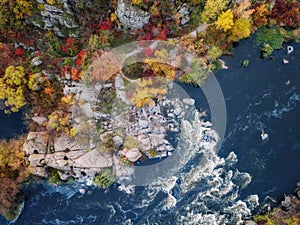 Aerial drone view of colorful forest, blue river and rocks. beautiful autumn landscape