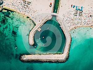 Aerial Drone View Of Concrete Pier On Turquoise Water At The Black Sea Resort Costinesti Of Romania photo