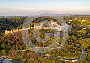 Aerial drone view of Convento de cristo christ convent in Tomar at sunrise, in Portugal