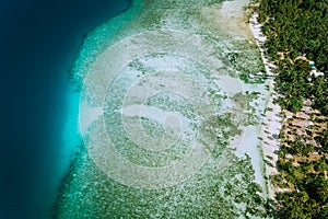 Aerial drone view of coral reef and shallow transparent lagoon water El Nido. Top down view. Bacuit archipelago. Palawan