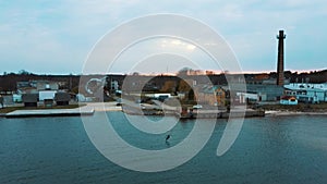 Aerial Drone View of a Corekites Kitesurfers Hydrofoiling  in Engure Port at in Baltic Sea