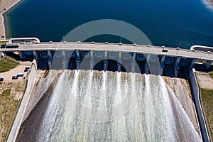 Aerial drone view of a dam over Lake Diefenbaker on a sunny day