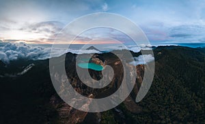 Aerial Drone view of Danau Volcano Kelimutu in Ende. Sunrise with colorful crater lakes. East Nusa Tenggara Aerial view