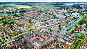 Aerial drone view of Delft town cityscape from above, typical Dutch city skyline with canals and houses, Holland, Netherlands