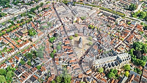 Aerial drone view of Delft town cityscape from above, typical Dutch city skyline with canals and houses, Netherlands