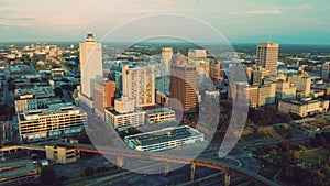 Aerial drone view of downtown Memphis from over the Mississippi River in the evening