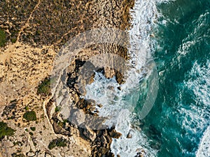 Aerial Drone View Of Dramatic Ocean Waves On Rocky Landscape