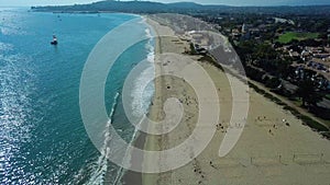 Aerial drone view drone is flying over beach upward waves. Top view