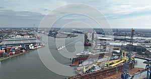 Aerial drone view of the Eemhaven in the port of Rotterdam, with short sea terminals in the background. Industrial port.