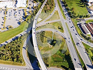 Aerial drone view of elevated road and traffic junctions. Large parking and transport highway. Modern construction design of