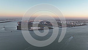 Aerial drone view on the europoort terminal in Rotterdam. Hoek van Holland and north sea at sunset.