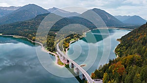 Aerial drone view of Faller-Klamm-Brucke bridge over Silvenstein lake, Karwendel mountain range Alps, Upper Bavaria