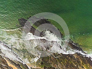 Aerial drone view on Fanore beach, county Clare, Ireland. Top down view, Stone rock coast line and ocean waves