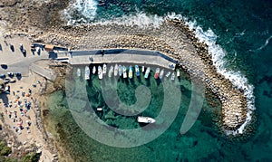 Aerial drone view of fishing boats moored at the harbor. moored at breakwater.