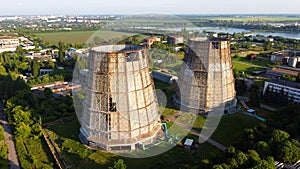 Aerial drone view flight near thermal power plant. Cooling towers of CHP