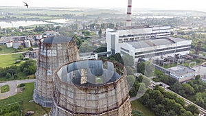 Aerial drone view flight near thermal power plant. Cooling towers of CHP