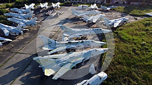 Aerial drone view flight over old rusty broken plane aircraft.