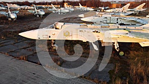 Aerial drone view flight over parking lot of old dismantled aircraft. Cemetery