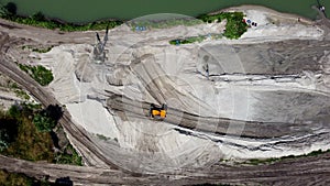 Aerial drone view flight over sand mining. Sand quarry. Top view.