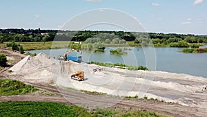 Aerial drone view flight over sand mining. Sand quarry. Top view.