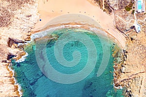 Aerial drone view of Fokos beach on Mykonos island, Greece