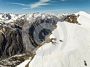 Aerial drone view of French Alps Mountains glacier near Grenoble. Europe alps in winter. Les deux alpes resort. Winter mountains