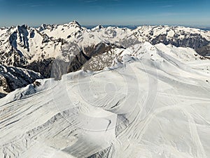 Aerial drone view of French Alps Mountains glacier near Grenoble. Europe alps in winter. Les deux alpes resort. Winter mountains