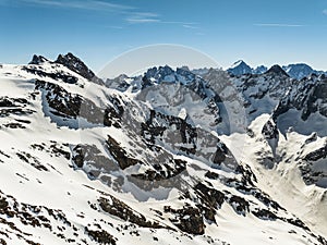 Aerial drone view of French Alps Mountains glacier near Grenoble. Europe alps in winter. Les deux alpes resort. Winter mountains