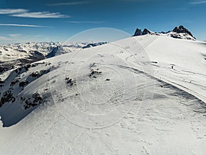 Aerial drone view of French Alps Mountains glacier near Grenoble. Europe alps in winter. Les deux alpes resort. Winter mountains