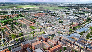 Aerial drone view of Gauda town cityscape from above, typical Dutch city skyline, Holland, Netherlands