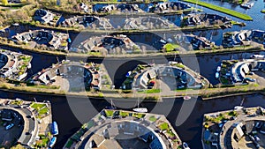 Aerial drone view geometric pattern of water houses, marina, yachts Marina Park Lemmer Netherlands