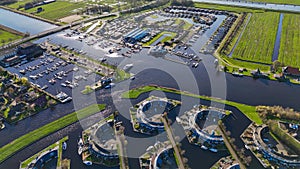 Aerial drone view geometric pattern of water houses, marina, yachts Marina Park Lemmer Netherlands