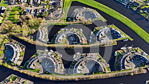 Aerial drone view geometric pattern of water houses, marina, yachts Marina Park Lemmer Netherlands