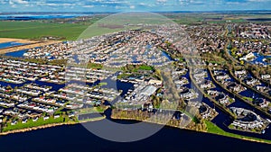 Aerial drone view geometric pattern of water houses, marina, yachts Marina Park Lemmer Netherlands