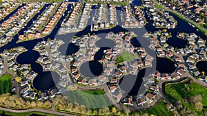 Aerial drone view geometric pattern of water houses, marina, yachts Marina Park Lemmer Netherlands