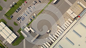 Aerial drone view of group of large modern industrial warehouse or factory buildings in suburban city area.Logistic transportation