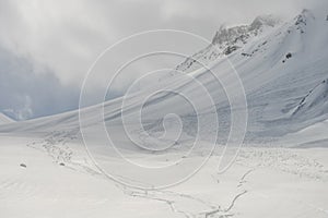 Aerial drone view of Gudauri ski resort in winter. Caucasus mountains in Georgia. Kudebi, Bidara, Sadzele, Kobi aerial panorama