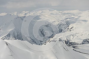 Aerial drone view of Gudauri ski resort in winter. Caucasus mountains in Georgia. Kudebi, Bidara, Sadzele, Kobi aerial panorama