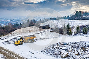 Aerial drone view on heavy machinery on road construction site in Polish Beskidy