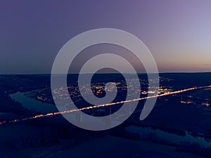 Aerial drone view of heavy traffic jam on German Autobahn bridge over Danube river near Sinzing, Regensburg, Bavaria at night with