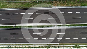 Aerial drone view on highway bridge road under construction. Construction of the viaduct on the modern new road.