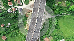 Aerial drone view on highway bridge road under construction. Construction of the viaduct on the modern new road.