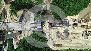 Aerial drone view on highway bridge road under construction. Construction of the viaduct on the modern new road.